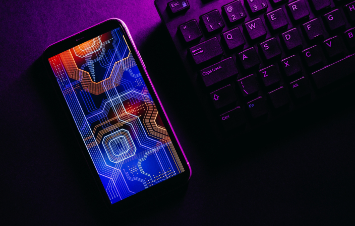 Smart phone next to a keyboard, futuristic