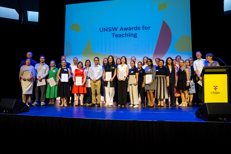 Group of award winning educators standing on a stage