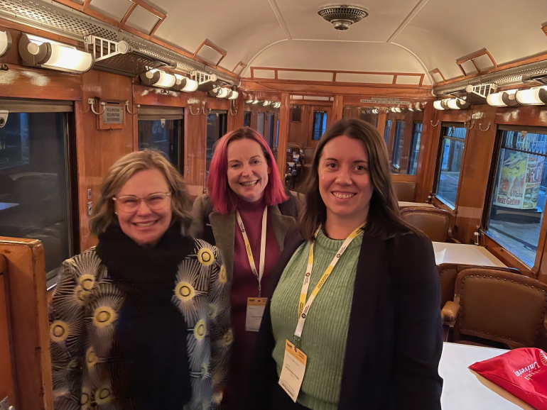 Academics in a train carriage at ISSOTL23