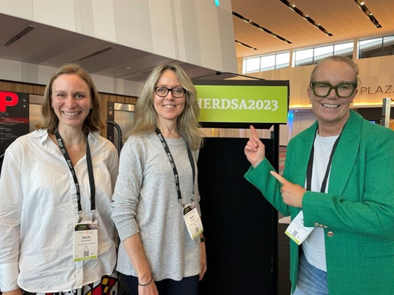 Academics smiling for photo at HERDSA 2023