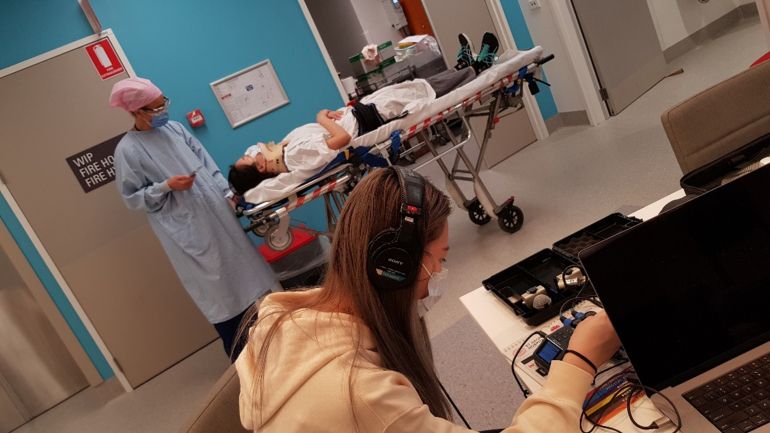 Winnie tuning the mics at the recording of the hospital trauma scenario for her WIL placement