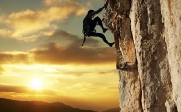 Person climbing a mountain