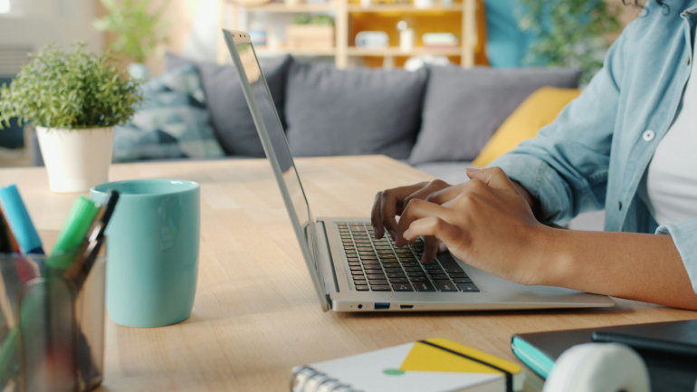 hands at a laptop