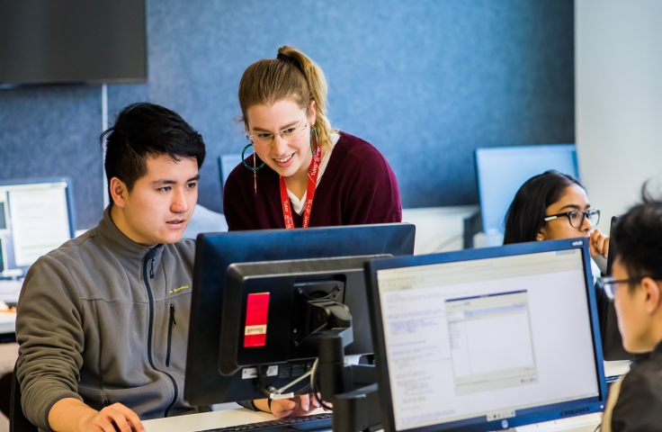 Student and teacher in a computer lab