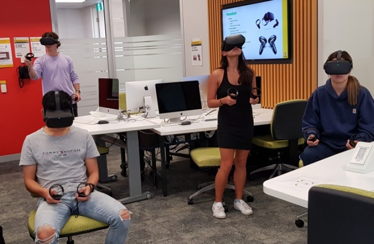 Students in a classroom using VR headsets