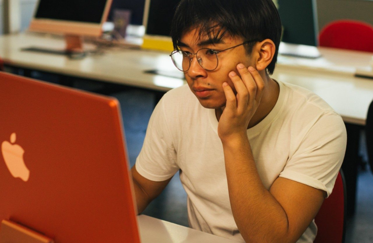 student looking at laptop