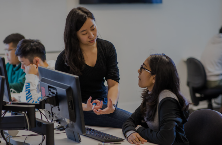 Student and teacher talking