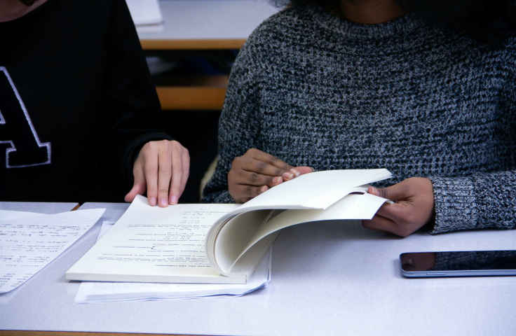 Student and teacher reviewing assessment