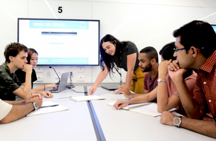 UNSW students learning together at a desk