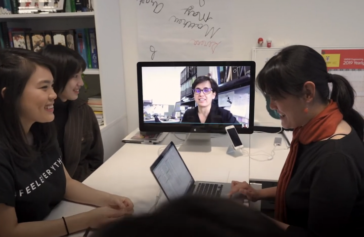 UNSW students and academic in front of a computer