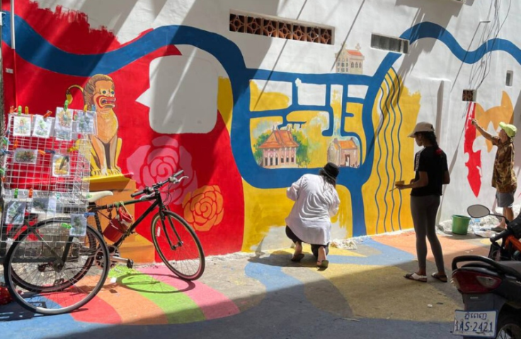 Man painting a mural