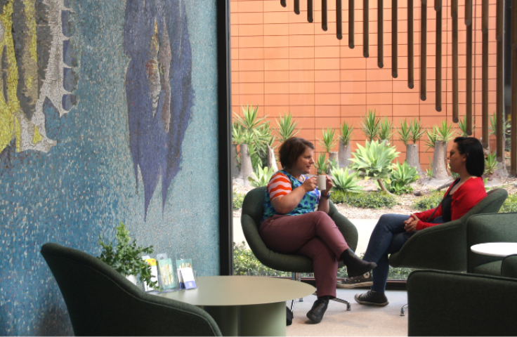 Staff sitting at Teaching Commons