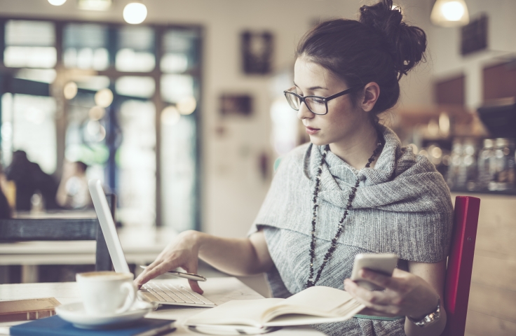 Female with laptop, mobile and coffee